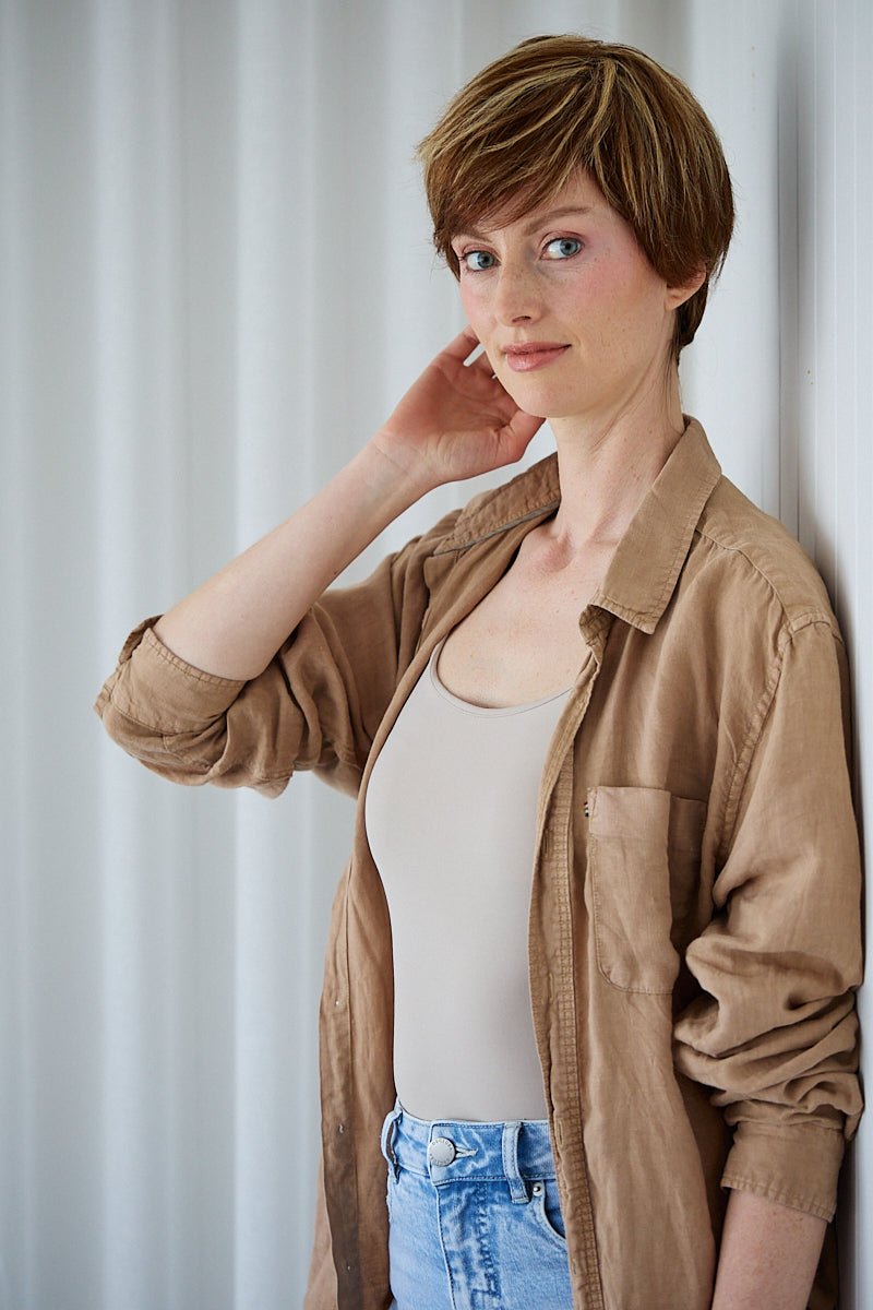Audrey highlighted brunette pixie wig with side-swept fringe, front view